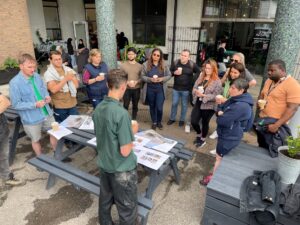 A team listen to briefing ahead of volunteering activity