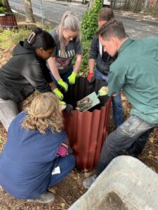 Team of volunteers build a mould for rammed earth plinths