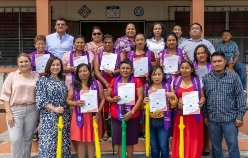 Group photo of female sugar cane farmers in Belize at their graduation