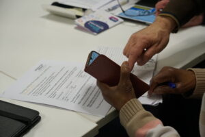 Two hands looking at a smartphone