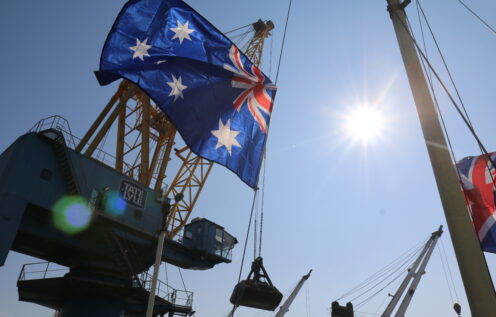 Australian flag flutters in front of Tate & Lyle crane