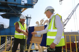 Handshake between Australian High Commissioner and Gerald Mason, Tate & Lyle Sugars