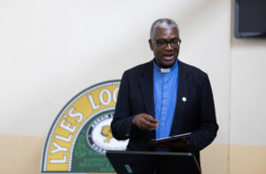 Man stands at a lectern and delivers a speech