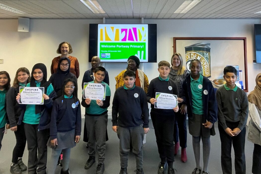 Group of students stand holding certificates