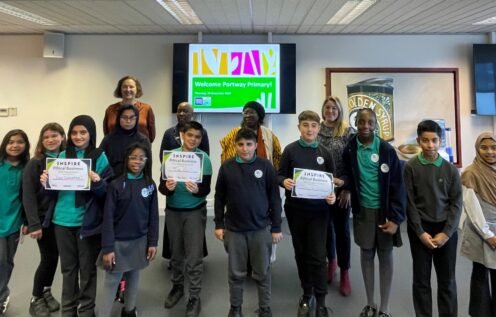 Group of students stand holding certificates