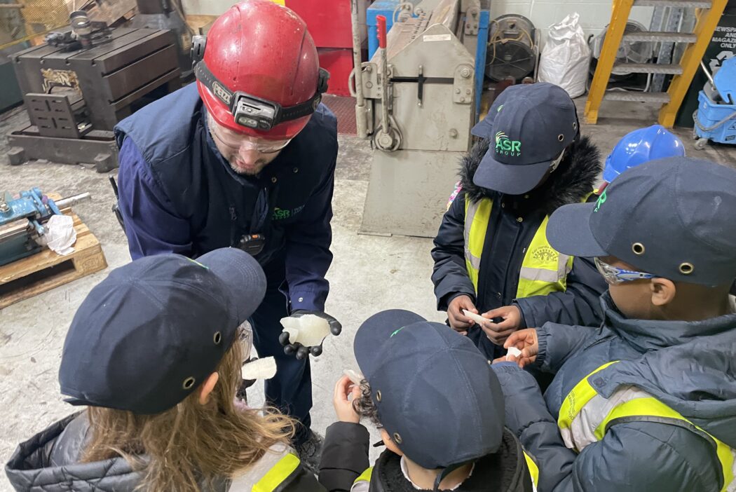 Engineer shows children a spanner