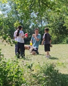 Forest School leader instructing children
