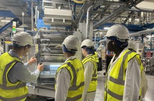 Work experience students in factory