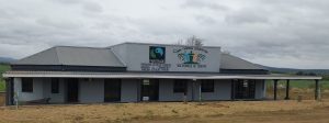 One story office building with fairtrade and sugarcane organisation logos on the sign
